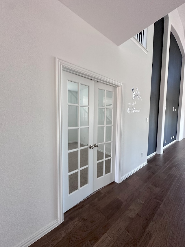 interior space featuring french doors and dark wood-type flooring