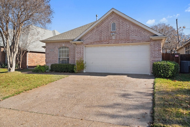 view of front facade featuring a front yard, a garage, and central AC unit