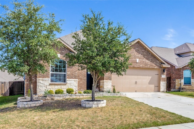 view of front of house featuring a garage and a front yard