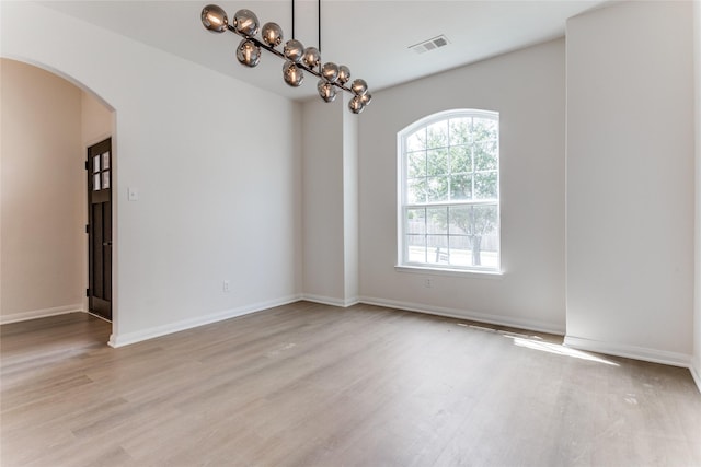 unfurnished room featuring light wood-type flooring