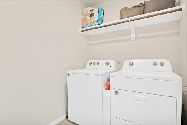 clothes washing area with washer and dryer