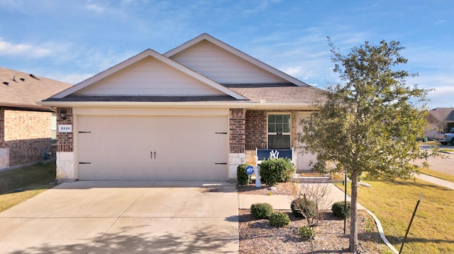 view of front of house with a front lawn and a garage