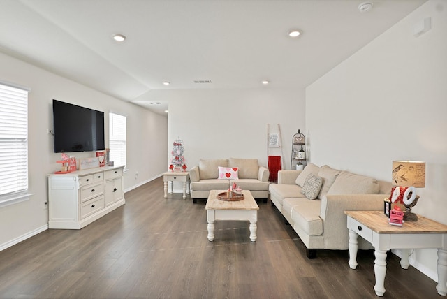 living room with plenty of natural light and dark hardwood / wood-style floors