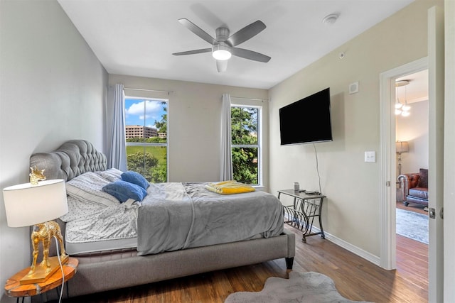 bedroom with wood-type flooring and ceiling fan