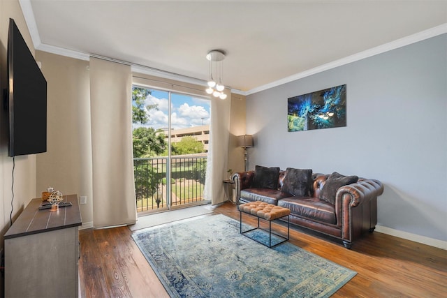 living room with dark hardwood / wood-style flooring and ornamental molding