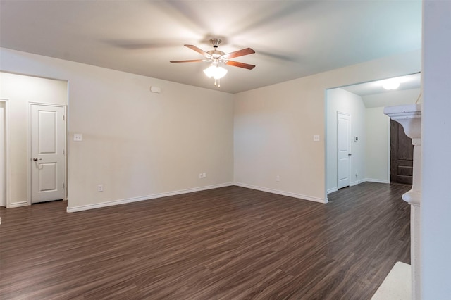 spare room with ceiling fan and dark hardwood / wood-style flooring