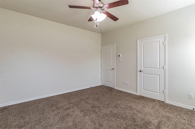 spare room with carpet and ceiling fan