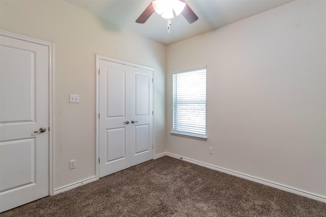 unfurnished bedroom featuring ceiling fan and carpet floors