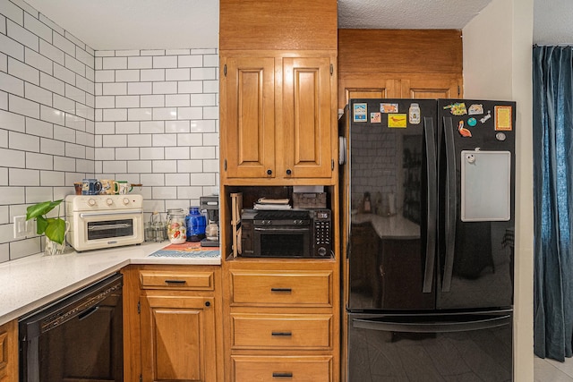 kitchen with decorative backsplash and black appliances