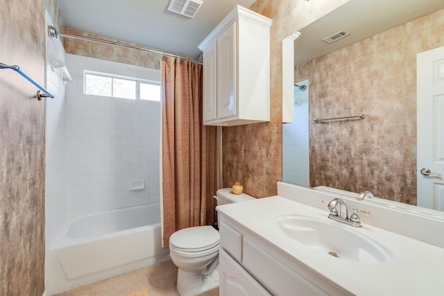 full bathroom with vanity, shower / bath combo, and toilet