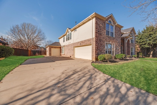 view of side of property with a lawn and a garage