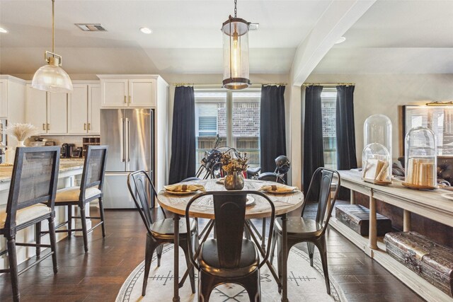 dining space featuring dark hardwood / wood-style flooring