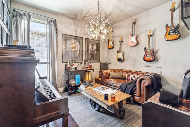 living room featuring hardwood / wood-style floors and a notable chandelier