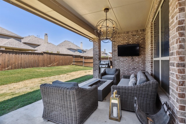 view of patio featuring an outdoor living space with a fire pit