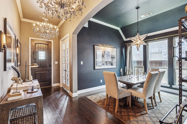 dining area with dark wood-type flooring, french doors, crown molding, vaulted ceiling, and a textured ceiling