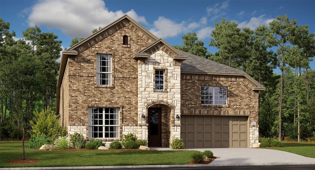 view of front of home with a garage and a front lawn