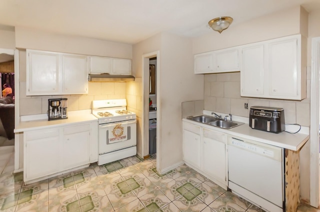 kitchen featuring white cabinets, white appliances, backsplash, and sink