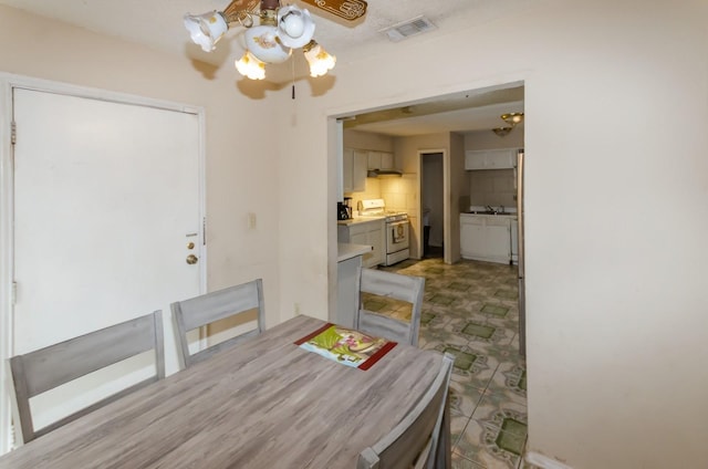 dining room featuring sink