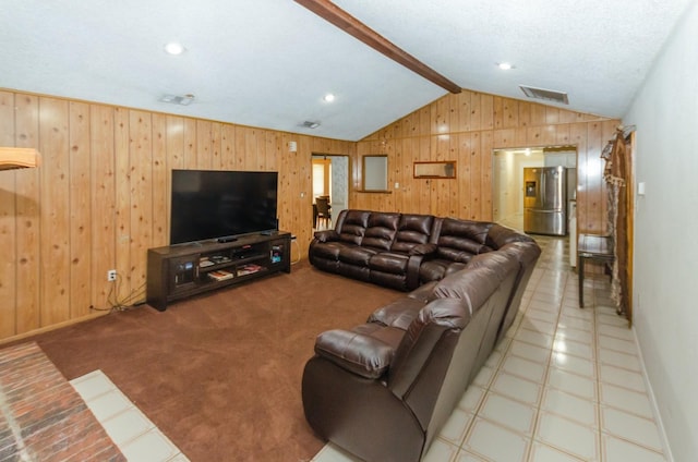 living room featuring carpet, a textured ceiling, vaulted ceiling with beams, and wooden walls