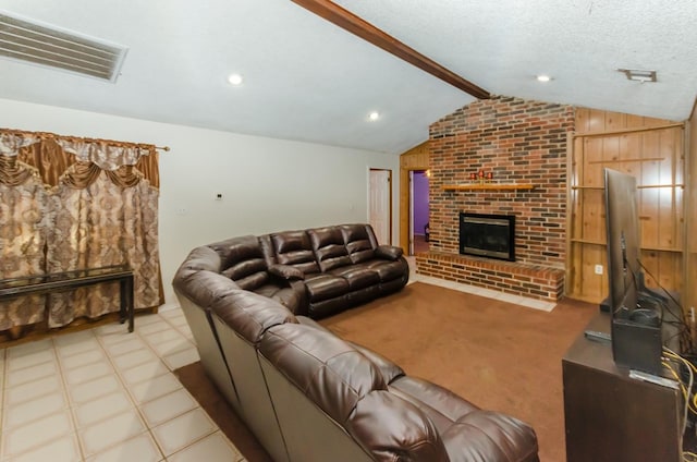 carpeted living room with vaulted ceiling with beams, a textured ceiling, wooden walls, and a brick fireplace