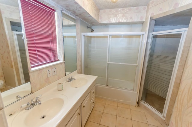 full bathroom featuring tile patterned flooring, enclosed tub / shower combo, a textured ceiling, toilet, and vanity