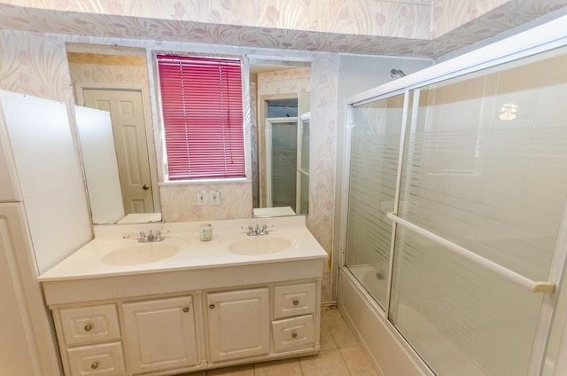 bathroom featuring shower / bath combination with glass door, tile patterned floors, and vanity