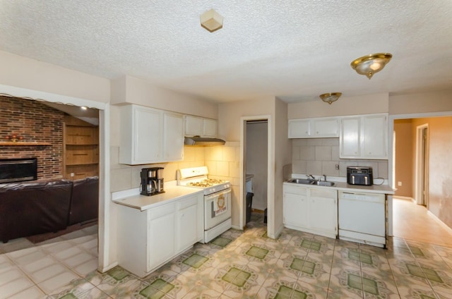 kitchen featuring decorative backsplash, white cabinetry, and white appliances