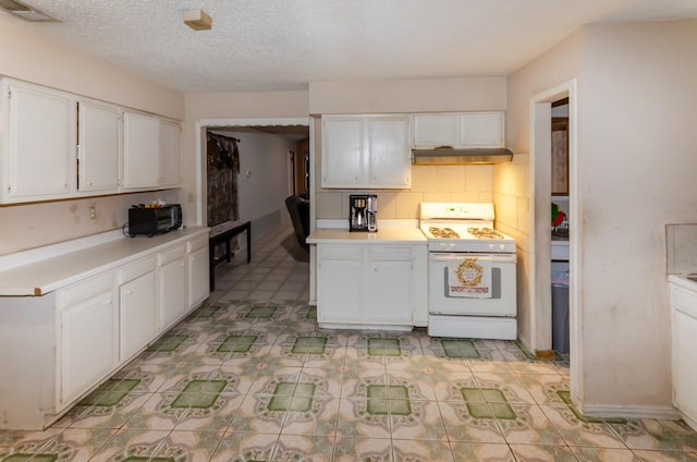 kitchen featuring white cabinets, backsplash, white stove, and a textured ceiling