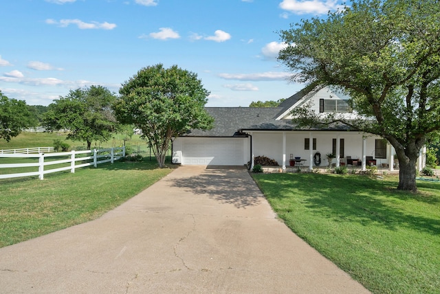 view of front facade featuring a front yard and a garage