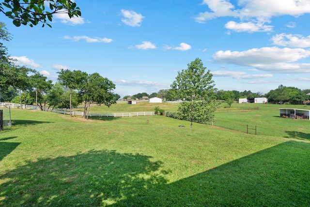 view of yard with a rural view