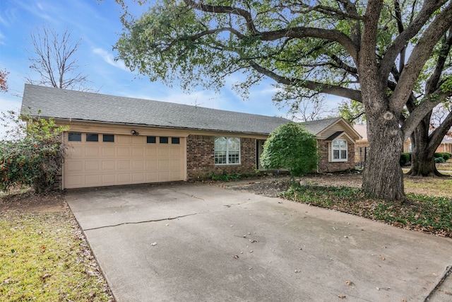 ranch-style home featuring a garage