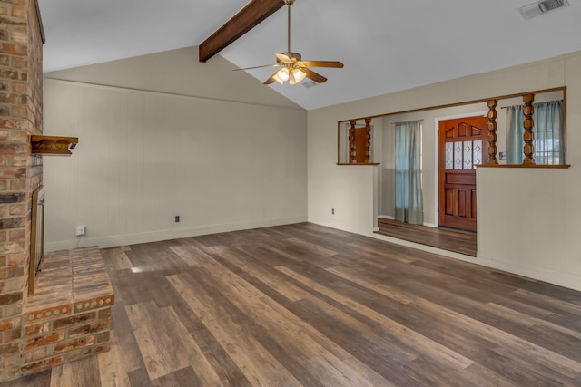 unfurnished living room with vaulted ceiling with beams, a brick fireplace, ceiling fan, and dark wood-type flooring