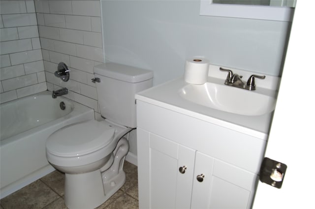 full bathroom with vanity, toilet, and tiled shower / bath combo