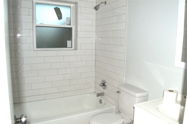 full bathroom with vanity, toilet, and tiled shower / bath