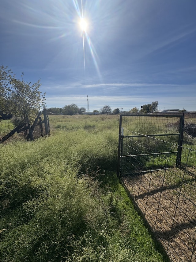 view of gate featuring a rural view