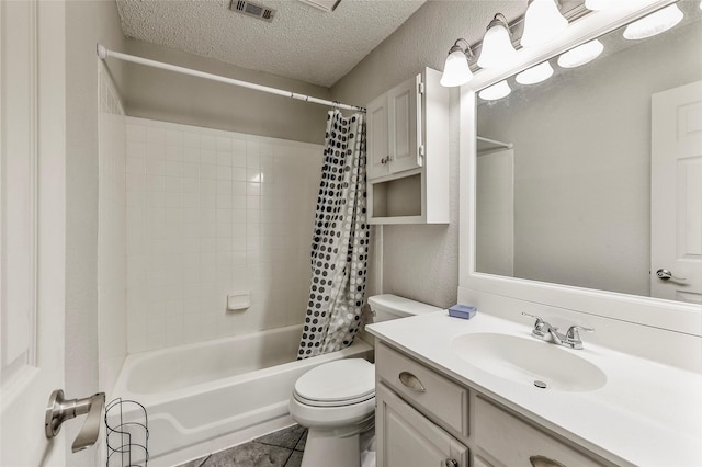 full bathroom featuring vanity, shower / bath combination with curtain, tile patterned flooring, toilet, and a textured ceiling