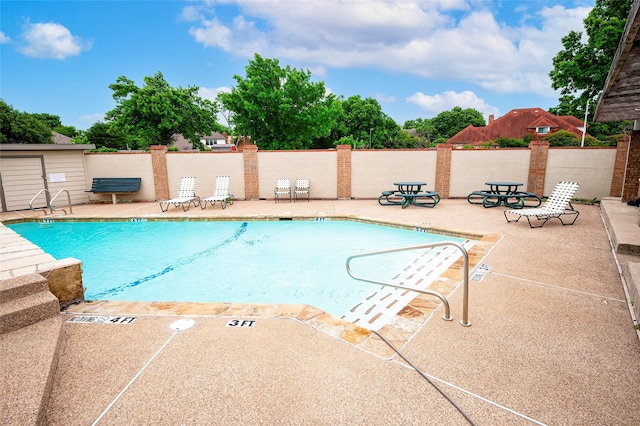 view of swimming pool with a patio area