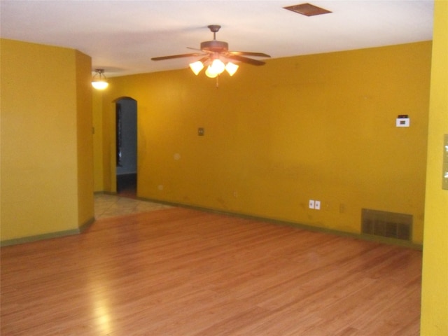 unfurnished room with ceiling fan and light hardwood / wood-style flooring