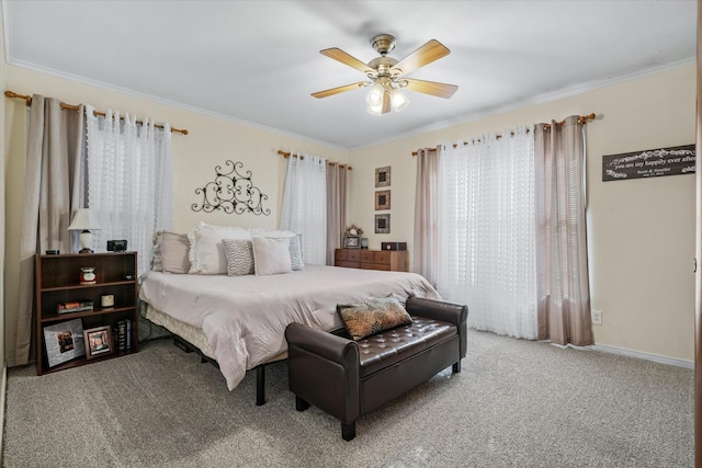 bedroom featuring baseboards, carpet, ornamental molding, and a ceiling fan