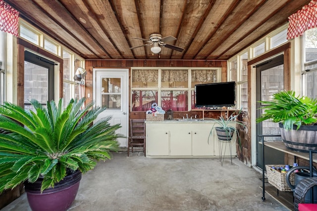 interior space featuring ceiling fan