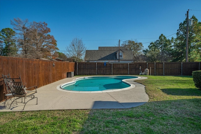 view of pool with a fenced in pool, a fenced backyard, a lawn, and a patio