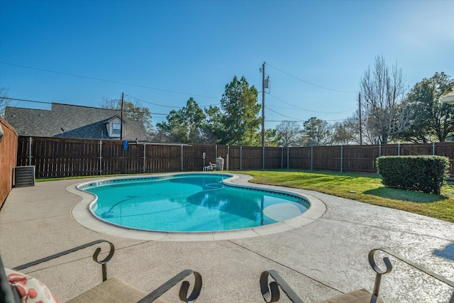 view of pool featuring a fenced in pool, a fenced backyard, a lawn, and a patio