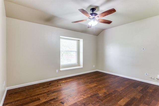 empty room with dark hardwood / wood-style floors, ceiling fan, and lofted ceiling