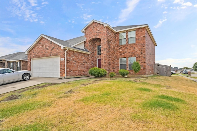 view of front of home featuring a front yard and a garage