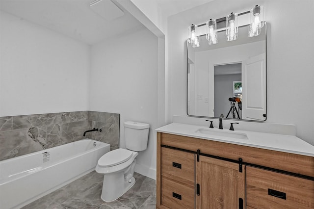 bathroom featuring a bathing tub, vanity, and toilet