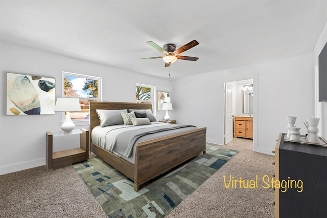 carpeted bedroom with connected bathroom and ceiling fan