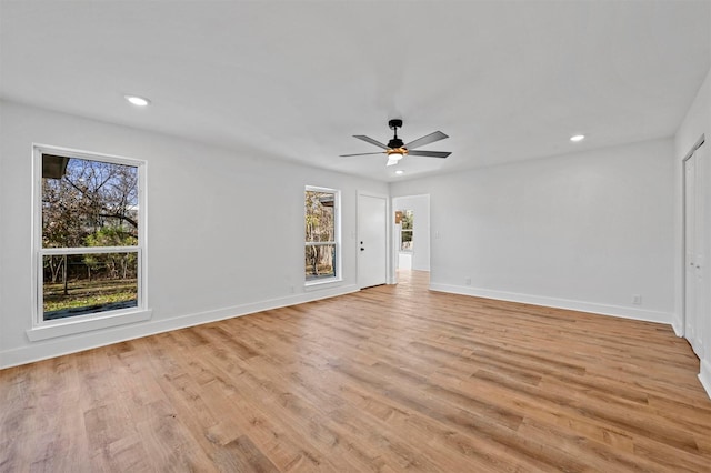 unfurnished room featuring ceiling fan and light hardwood / wood-style floors