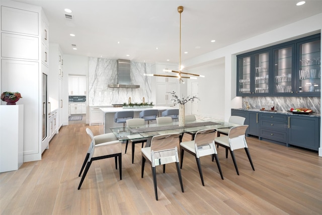 dining area with light wood-type flooring