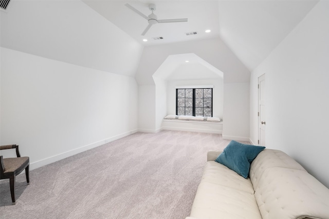 interior space with ceiling fan, light colored carpet, and lofted ceiling