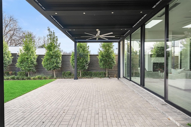 view of patio featuring ceiling fan